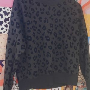 I’m selling a leopard print black sweatshirt.